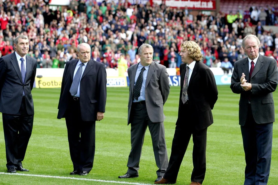 A 2004 photo shows former Nottingham Forest players (from left) Peter Shilton, John Robertson, Tony Woodcock and Frank Clark paying their  respects to the late Brian Clough.