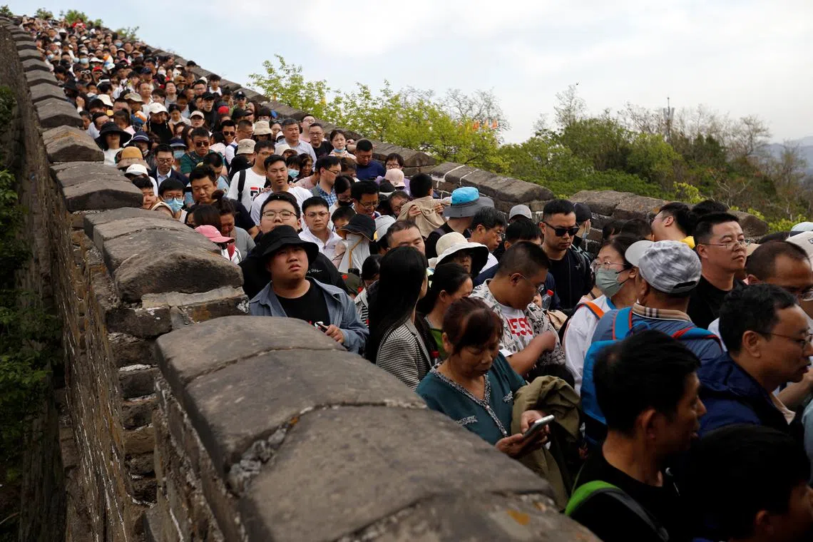 People visit the Mutianyu section of the Great Wall during the five-day Labour Day holiday in Beijing, China April 30, 2023. REUTERS/Florence Lo