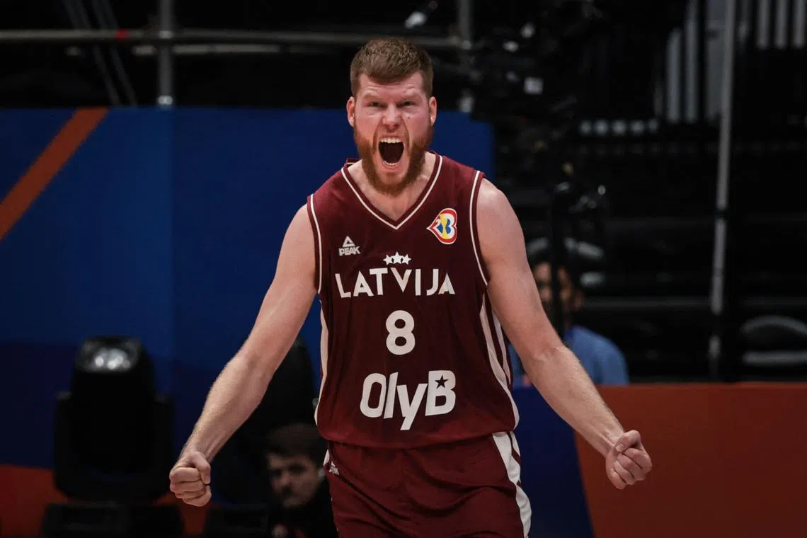 Latvia's Davis Bertans reacts after scoring a three-point shot in the shock win over champions Spain at the Basketball World Cup.