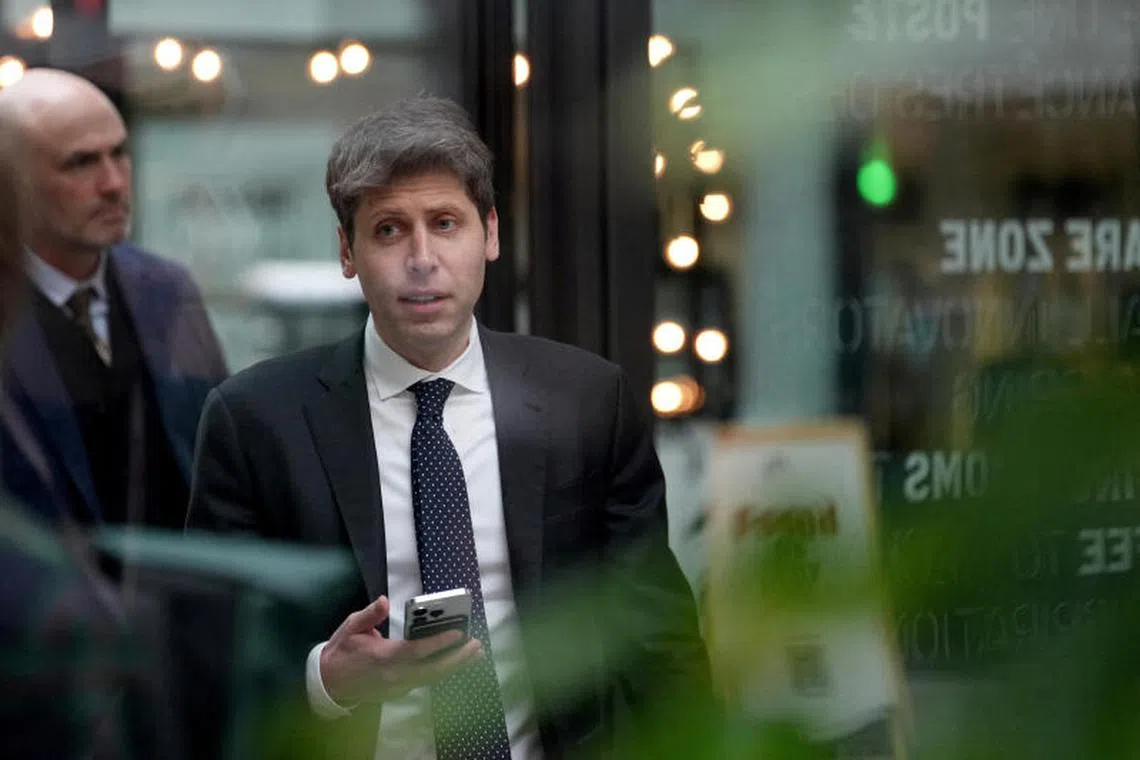 Sam Altman, CEO of OpenAI, at Station F, is seen through glass, during an event on the sidelines of the Artificial Intelligence Action Summit in Paris, France, Feb. 11, 2025. Aurelien Morissard/Pool via REUTERS