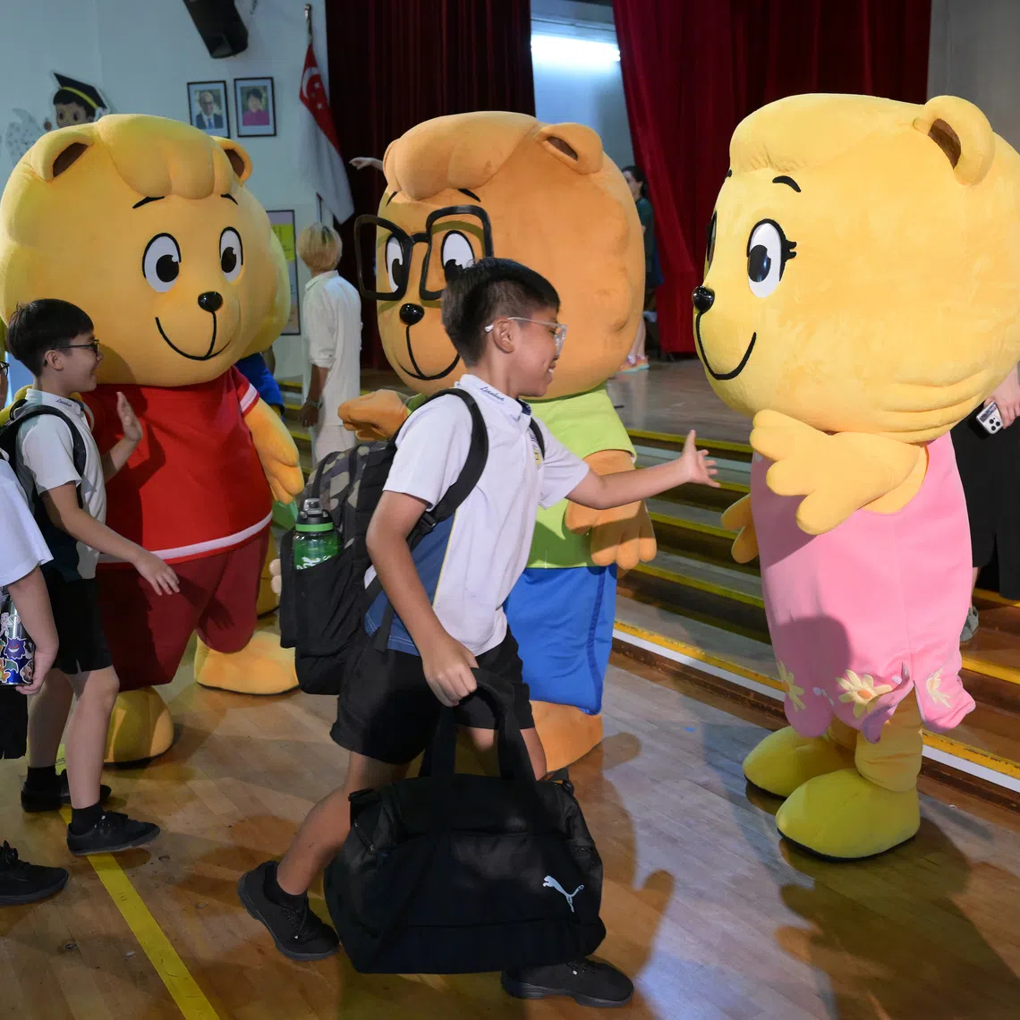 Lianhua Primary School pupils greeting the Singapore Kindness Movement's Kindness Cubbies during the school's celebration of Kindness Day on May 13.