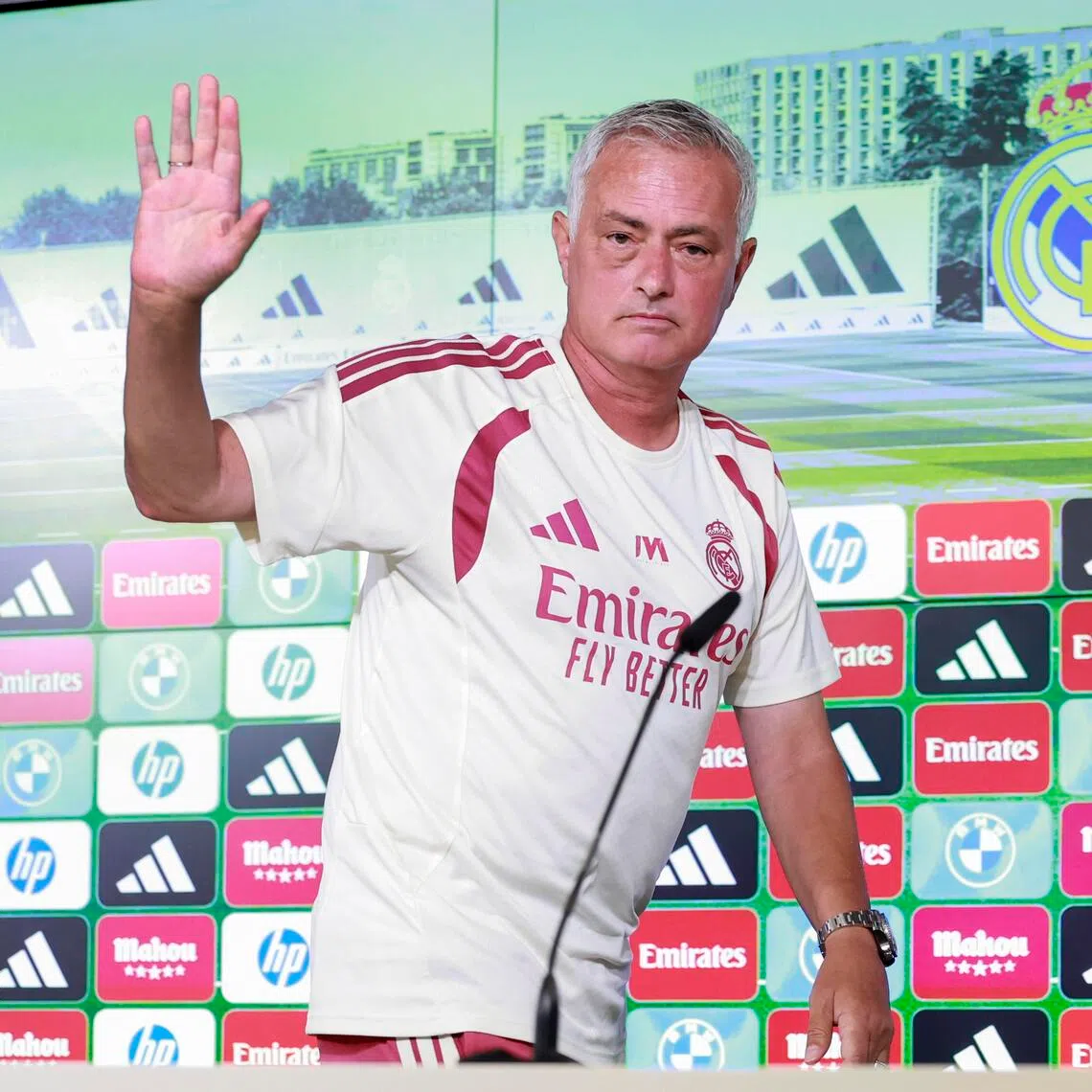 Real Madrid coach Jose Mourinho waves after attending a press conference prior to their La Liga match against Espanyol on Aug 22.