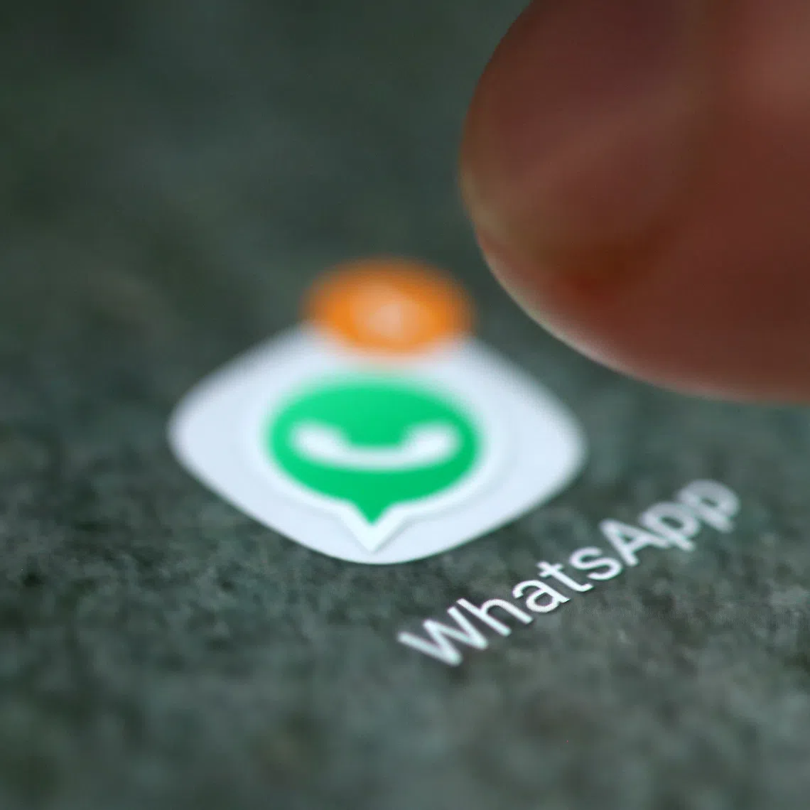 The WhatsApp app logo is seen on a smartphone in this picture illustration taken September 15, 2017. REUTERS/Dado Ruvic/Illustration