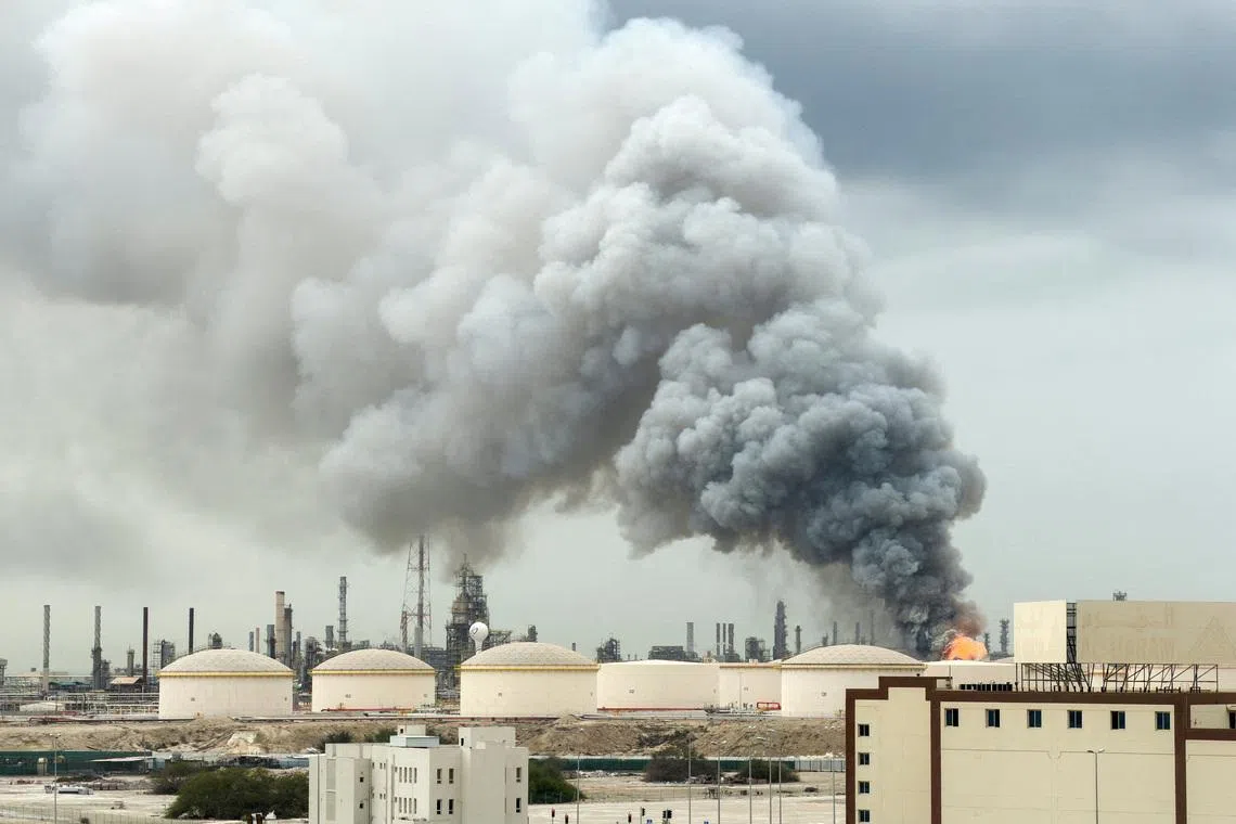 Smoke rising following a strike on the Bapco Oil Refinery on Sitra Island in Bahrain on March 9.