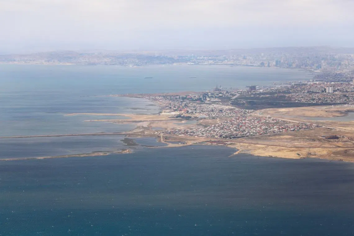 FILE PHOTO: An aerial view of the Caspian Sea near the city of Baku through the window of an airplane, in Baku Azerbaijan May 27, 2019. REUTERS/Amr Abdallah Dalsh/File Photo