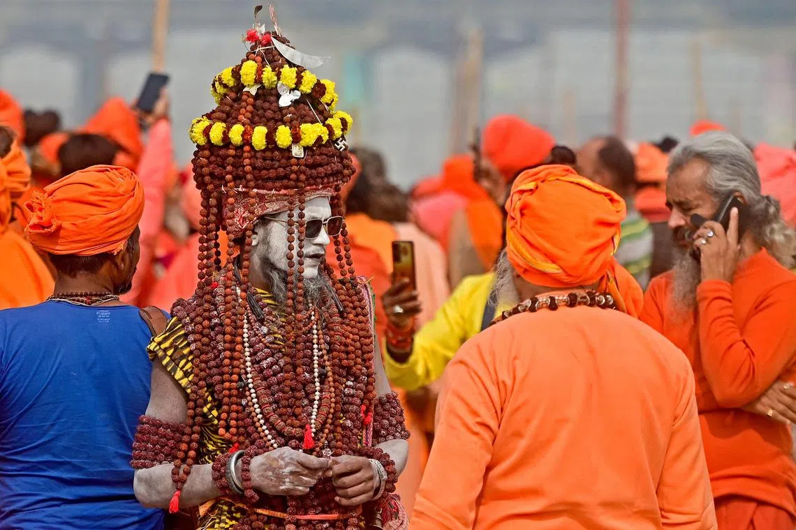 Sadhus or Hindu holy men arriving to raise Dharam Dhwaja (religious flag) ahead of the Maha Kumbh Mela festival in Prayagraj on Nov 23, 2024. 