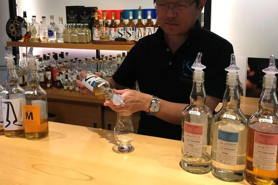 Taiko Nakamura pours a dram of whisky in the tasting room of the distillery he founded in Shizuoka, Shizuoka Prefecture, Japan October 25, 2023. REUTERS/Rocky Swift/File Photo