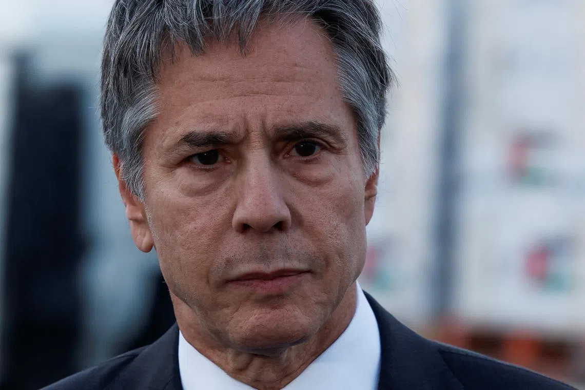 FILE PHOTO: U.S. Secretary of State Antony Blinken reacts, as he speaks to the press in front of a truck with humanitarian aid bound for Gaza at the Jordanian Hashemite Charity Organization in Amman, Jordan, April 30, 2024. REUTERS/Evelyn Hockstein/Pool/File Photo