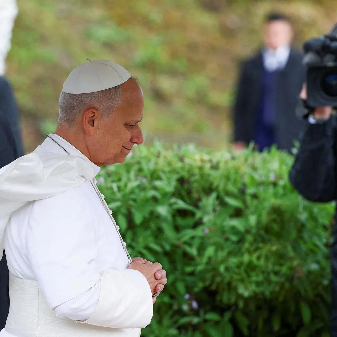 Pope Leo XIV prays during his visit to the archaeological site of Hippo Regius in Annaba, Algeria, April 14, 2026. REUTERS/Guglielmo Mangiapane