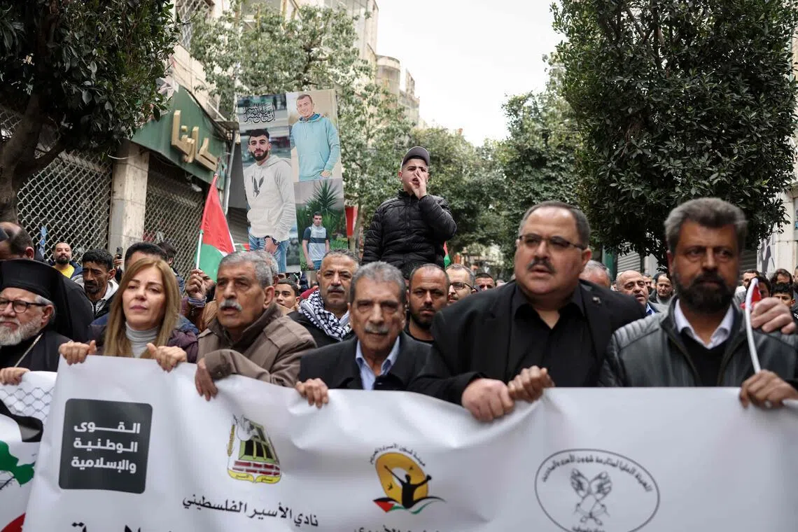 Palestinian demonstrators march in the occupied West Bank on April 1 during a protest against the Israeli Parliament's approval of a new death penalty Bill.