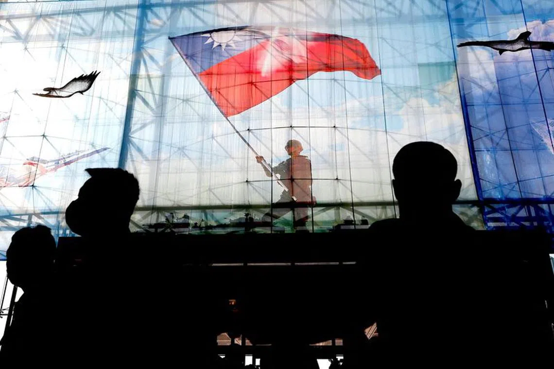 FILE PHOTO: Taiwanese flags are seen at the Ministry of National Defence of Taiwan in Taipei, Taiwan, December 26, 2022. REUTERS/Ann Wang/File Photo