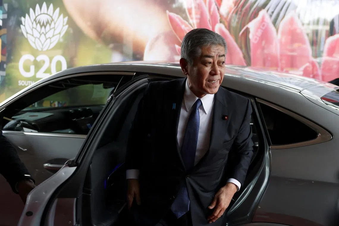 FILE PHOTO: Japanese Foreign Minister Takeshi Iwaya walks out of a car to attend the meeting of the G20 foreign ministers in Johannesburg, South Africa, February 20, 2025. REUTERS/Siphiwe Sibeko/File Photo