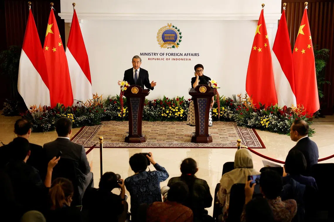 Chinese Foreign Minister Wang Yi speaks as Indonesian Foreign Minister Retno Marsudi listens during a joint press conference following their bilateral meeting in Jakarta, Indonesia, April 18, 2024. REUTERS/Willy Kurniawan