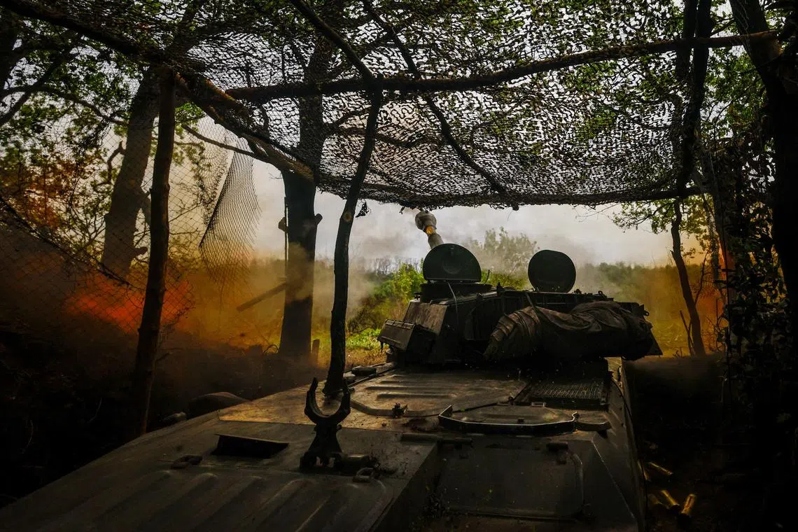 Ukrainian servicemen fire a self-propelled howitzer in the direction of Russian positions on the outskirts of Kupyansk, Ukraine.