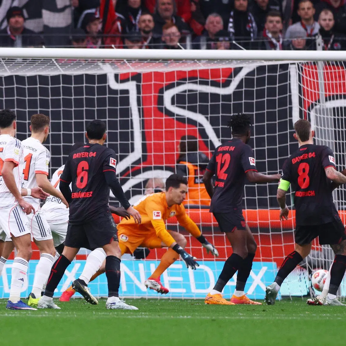 Soccer Football - Bundesliga - Bayer Leverkusen v Bayern Munich - BayArena, Leverkusen, Germany - March 14, 2026 Bayern Munich's Jonathan Tah scores a goal before it was disallowed following a VAR review REUTERS/Thilo Schmuelgen