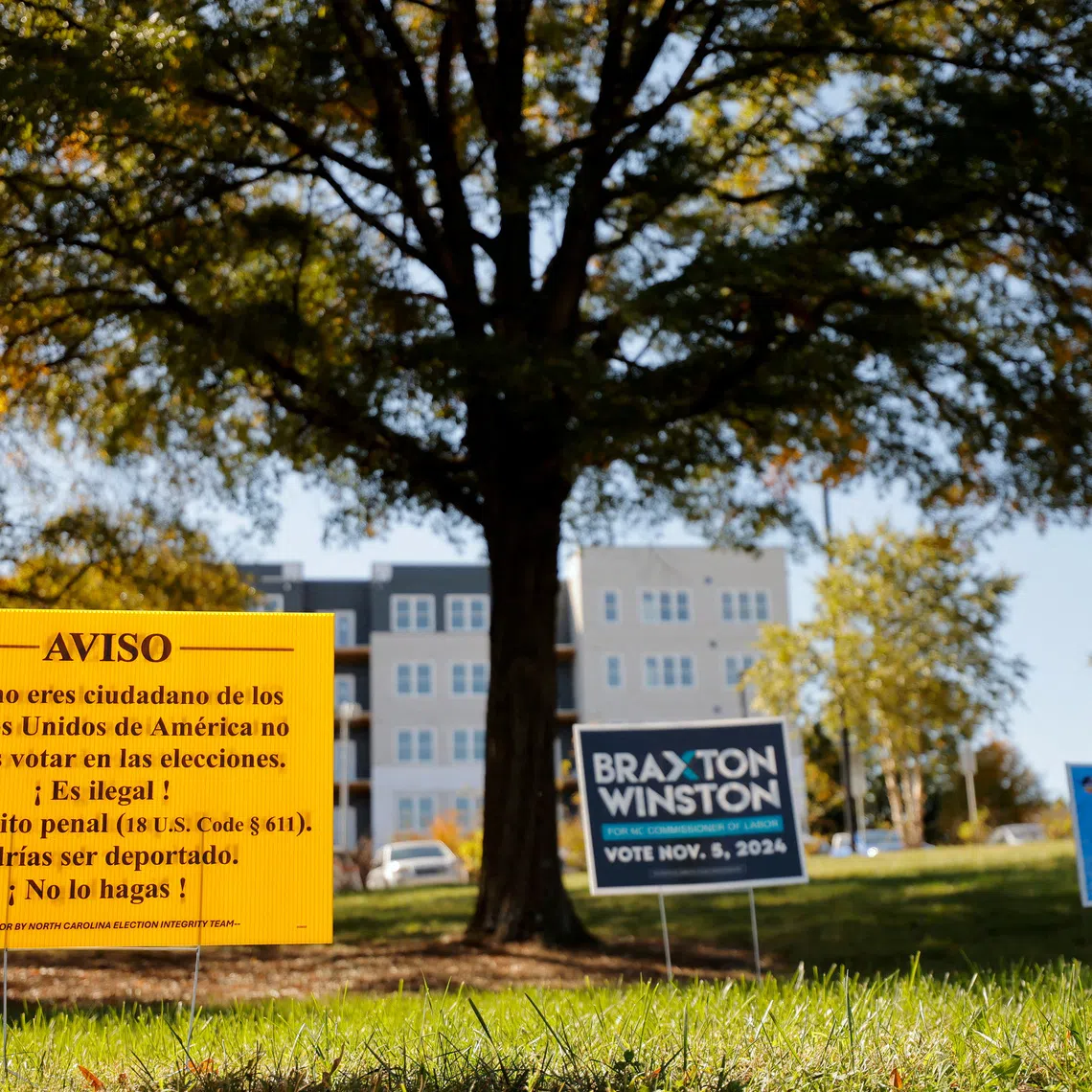 FILE PHOTO: A North Carolina Election Integrity Team sign in Spanish warning non-citizens not to vote and that doing so could lead to deportation, a notice that advocacy groups say could intimidate legitimate voters who speak Spanish, ahead of the U.S. presidential election, is displayed near an early voting site in Durham, North Carolina, U.S. October 25, 2024. REUTERS/Jonathan Drake/File Photo