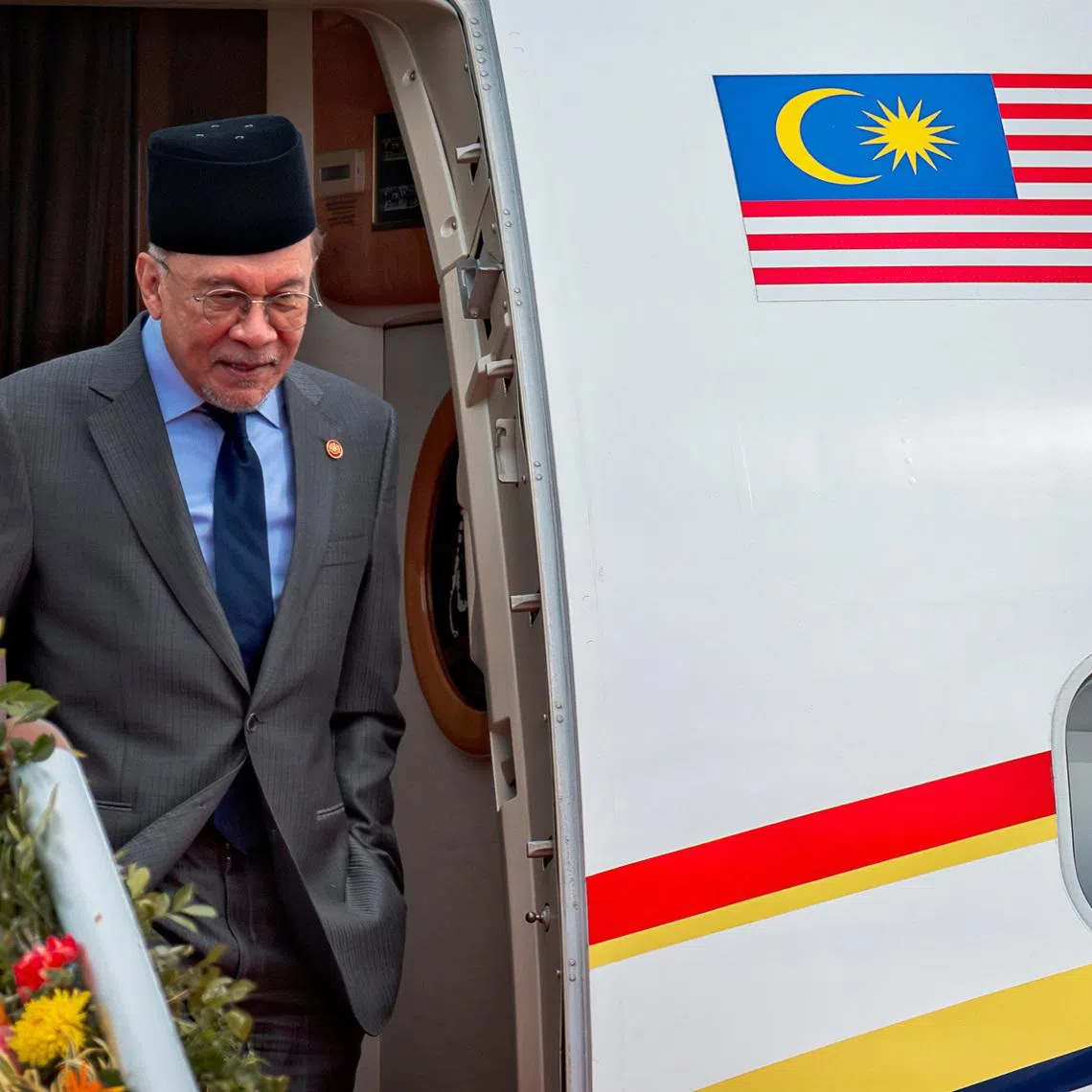 Malaysian Prime Minister Anwar Ibrahim arrives at Mactan-Benito Ebuen Air Base ahead of the 48th ASEAN Summit and Related Meetings in Cebu, Philippines, May 7, 2026. Ezra Acayan/Pool via REUTERS