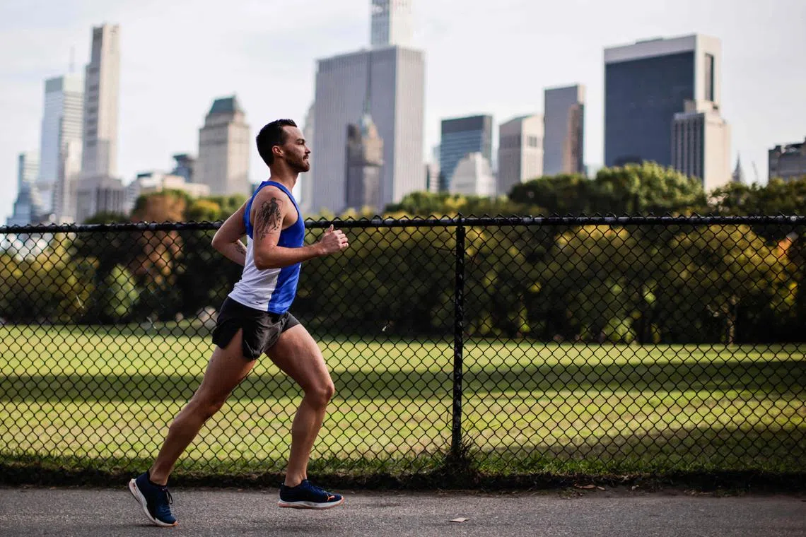 Nick Dill, an athlete competing in the non-binary category, runs in Central Park on Oct 12 in preparation for the New York City Marathon.