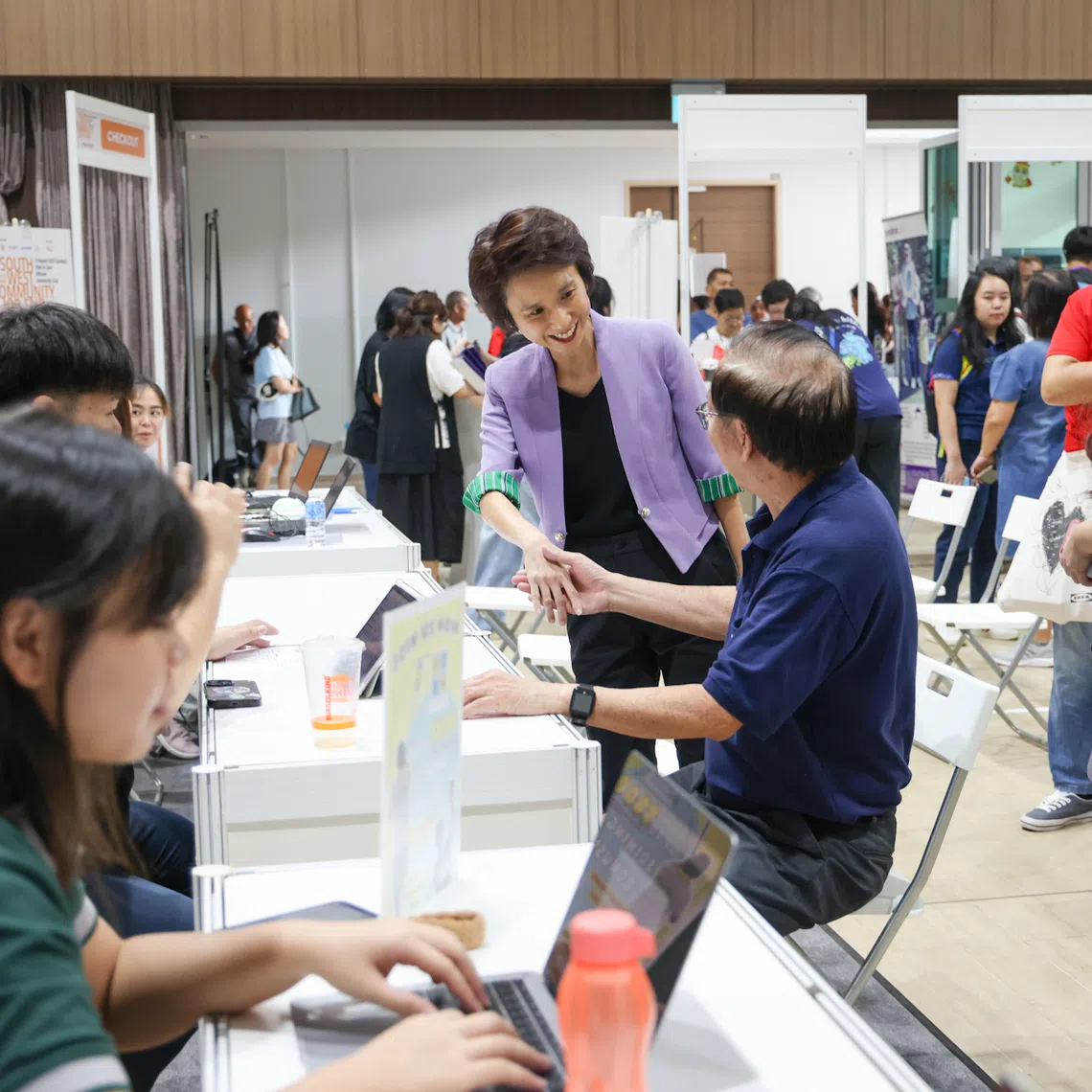 South West District Mayor Low Yen Ling (in purple jacket) meeting jobseekers at the job fair held at Hillview Community Club on Aug 31.