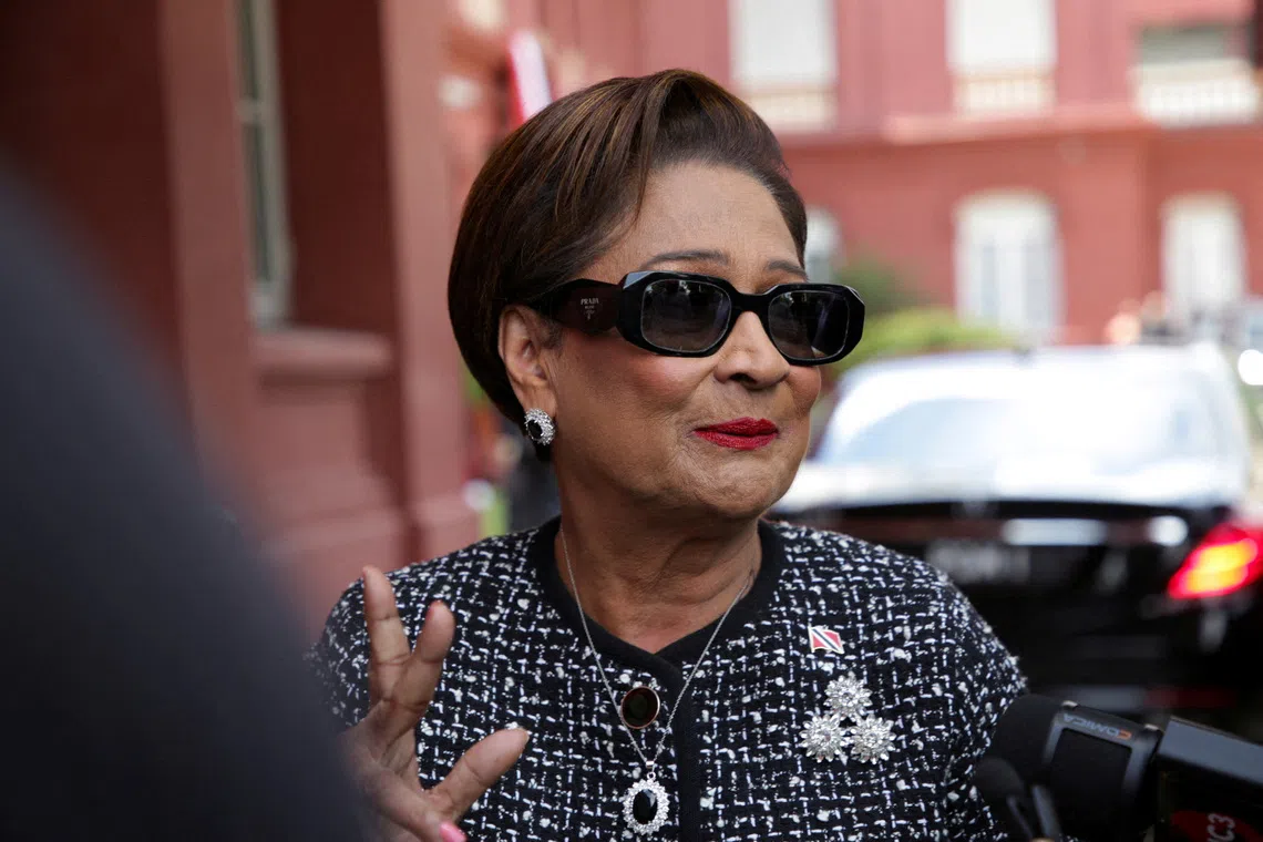 FILE PHOTO: Prime Minister of Trinidad and Tobago Kamla Persad-Bissessar replies to the media after being asked about the presence of U.S. military in the southern Caribbean, at the Red House, parliamentary building, in Port of Spain, Trinidad and Tobago, September 12, 2025. REUTERS/Andrea De Silva/File Photo