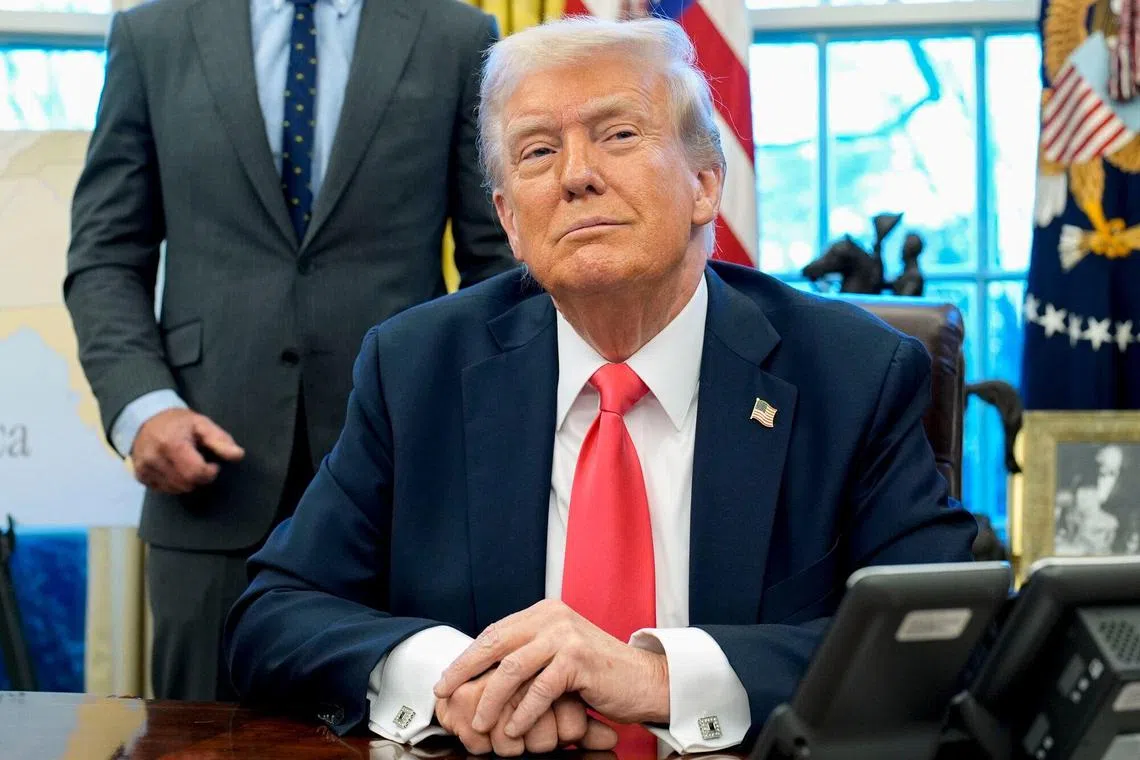US President Donald Trump during an executive order signing in the Oval Office of the White House in Washington, DC, US, on Tuesday, Feb. 25, 2025. Trump signed an executive action directing the Commerce Department to examine possible copper tariffs, the latest in a string of measures aimed at imposing sector-specific levies that offer to reshape global supply chains. Photographer: Yuri Gripas/Abaca/Bloomberg