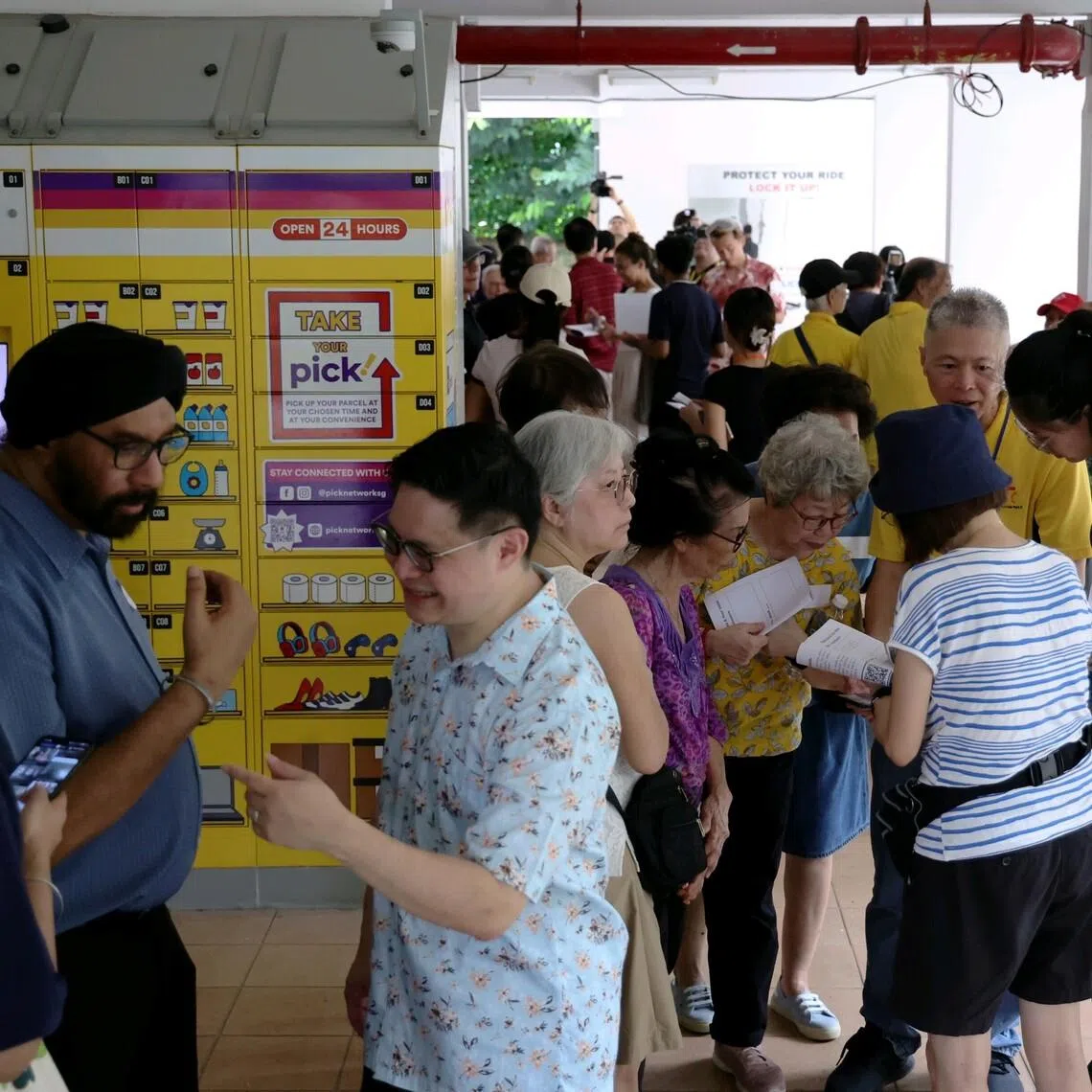 Tanjong Pagar MP Foo Cexiang with residents of Spottiswoode Park during a discovery walk to explore potential sites for renewal in the estate on April 26.