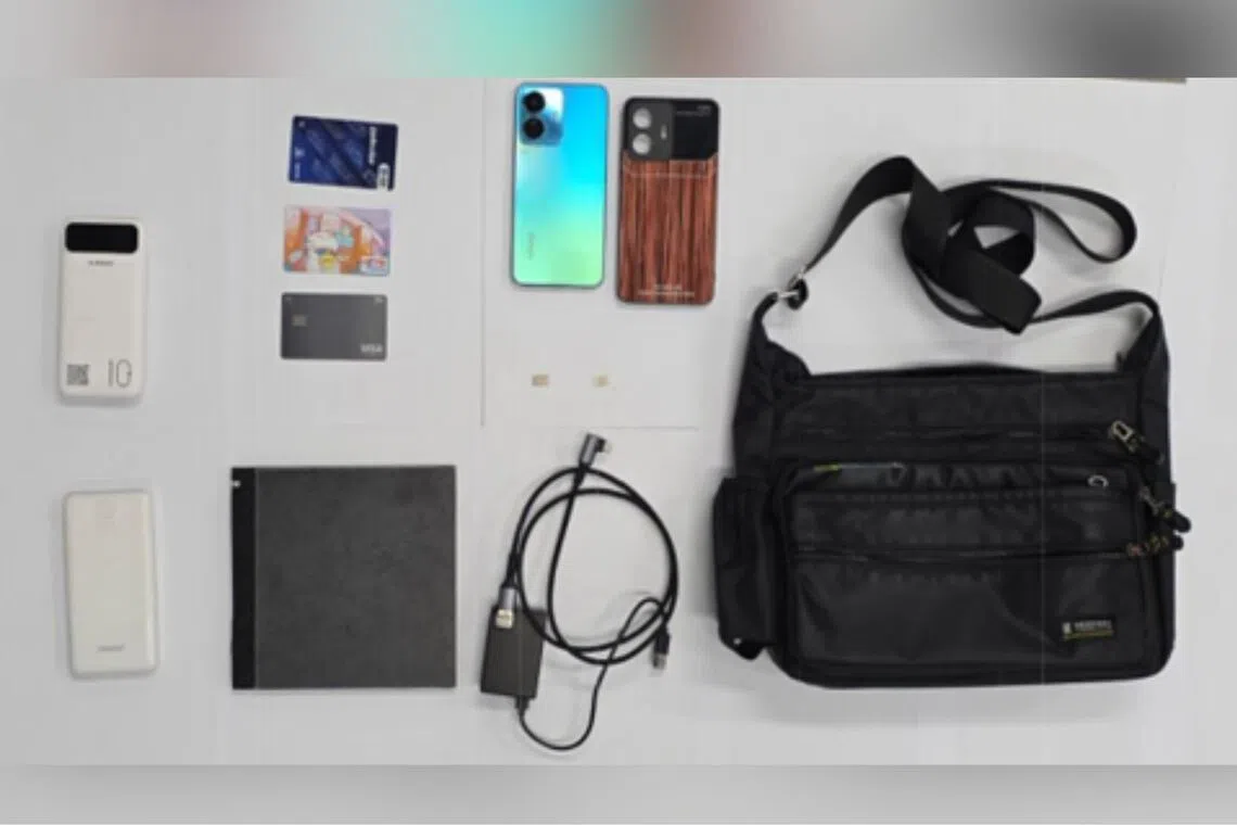 An electronic device, two power banks, a mobile phone and several bank cards were found in his possession and seized as case exhibits.