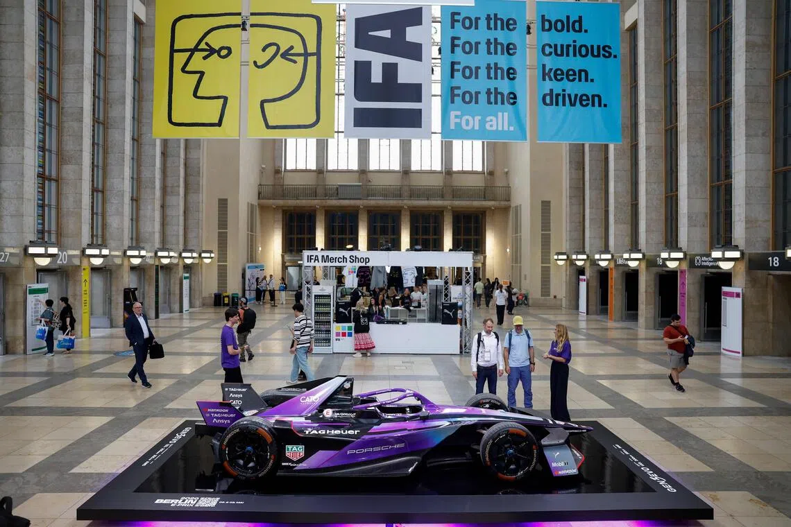 A Porsche Formula E race car is seen at the entrance to the IFA international trade show for consumer electronics and home appliances, on Sept 5, 2025 in Berlin. Porsche won both the Formula E team and manufacturers' championships.