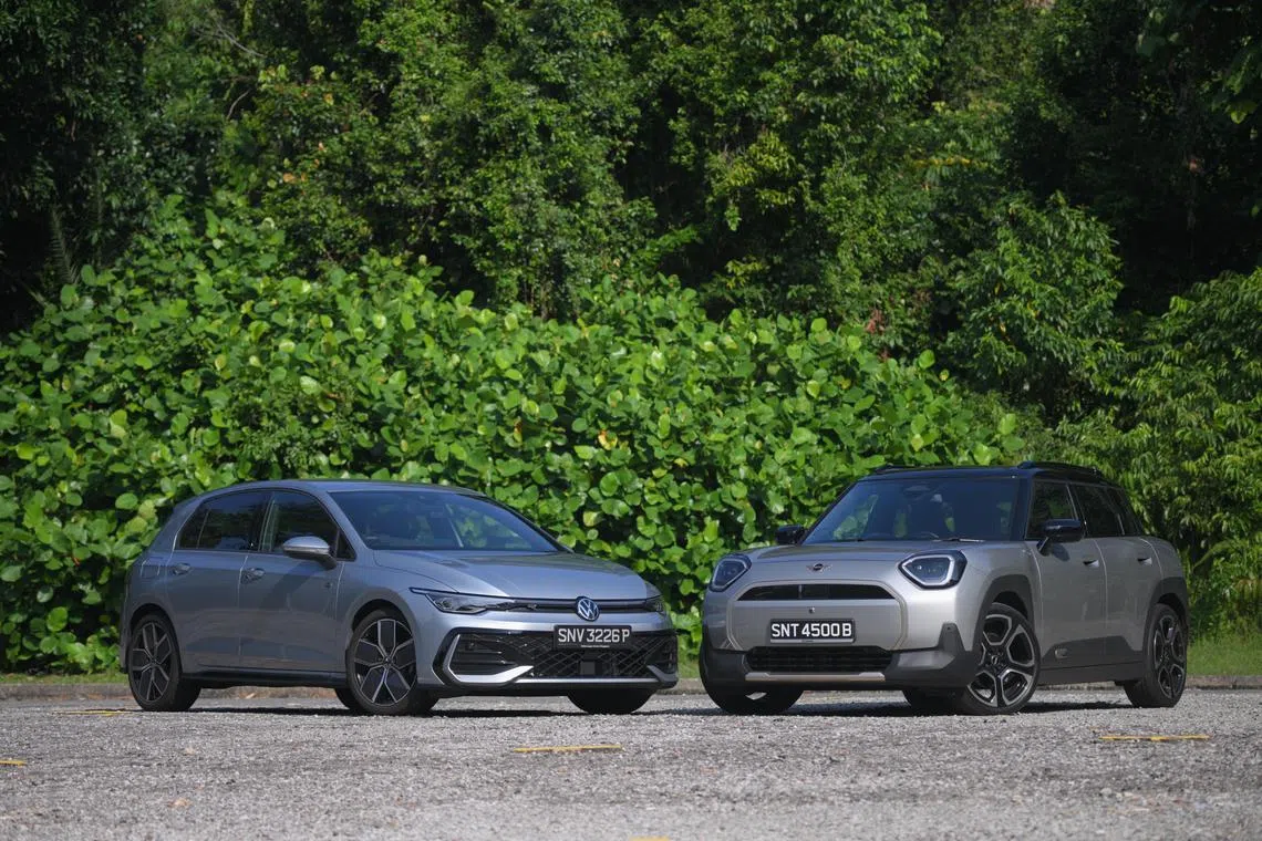 The Volkswagen Golf R Line (left) and the Mini Aceman E pictured on July 22, 2025.
