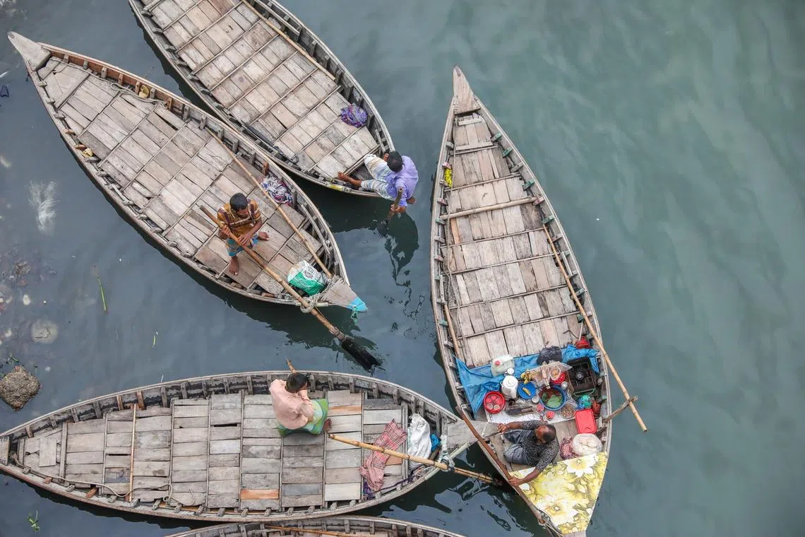 Boatsmen anchoring their boats in the Buriganga River in Dhaka, Bangladesh, on June 17, 2026. 