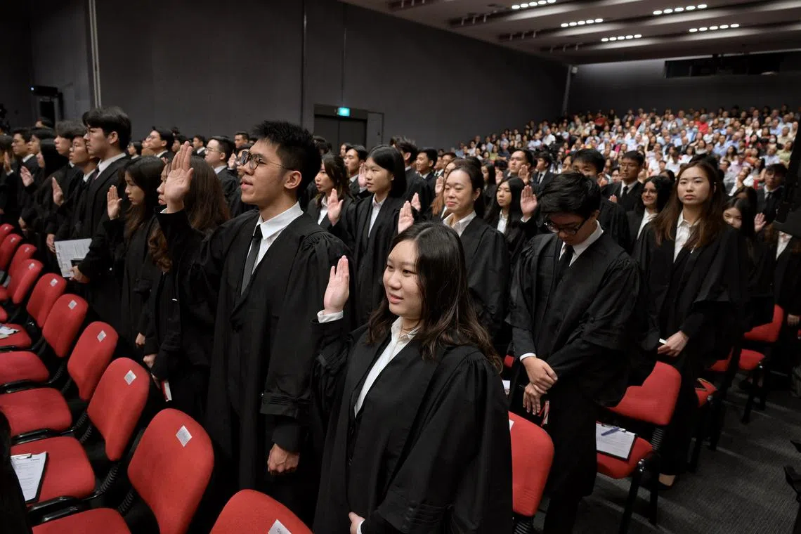 Newly appointed Advocates and Solicitors making their declarations at Mass Call 2024, held at the Supreme Court auditorium. This is the first of three sessions where 441 newly appointed Advocates and Solicitors are being called to the Singapore Bar.