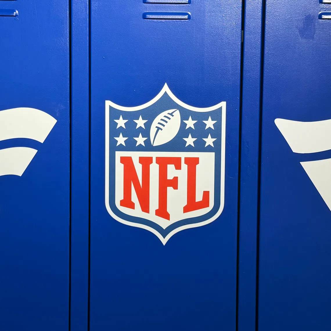 Oct 2, 2026; London, United Kingdom; The NFL shield and Fanatics logos at a locker room display at the NFL Shop on Oxford Street. Mandatory Credit: Kirby Lee-Imagn Images