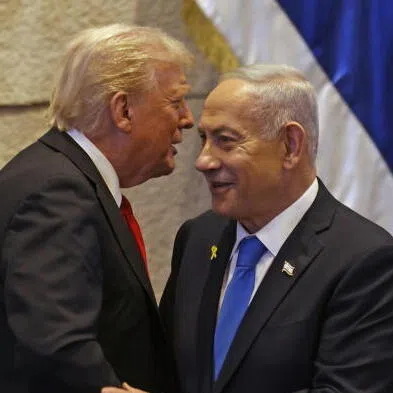 US President Donald Trump (left) speaking with Israel's Prime Minister Benjamin Netanyahu at the Israeli Parliament in Jerusalem, Israel, on Oct 13.