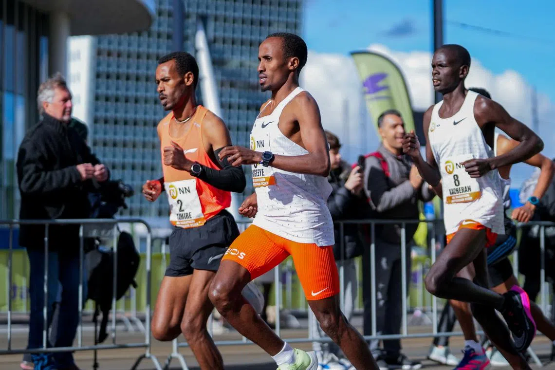 FILE PHOTO: Dutch runner Abdi Nageeye wears a CGM (continuous glucose monitor) on his upper left arm as he competes in the 2022 Rotterdam marathon, in Rotterdam, Netherlands, April 2022. NN Running Team/Handout via REUTERS/File Photo