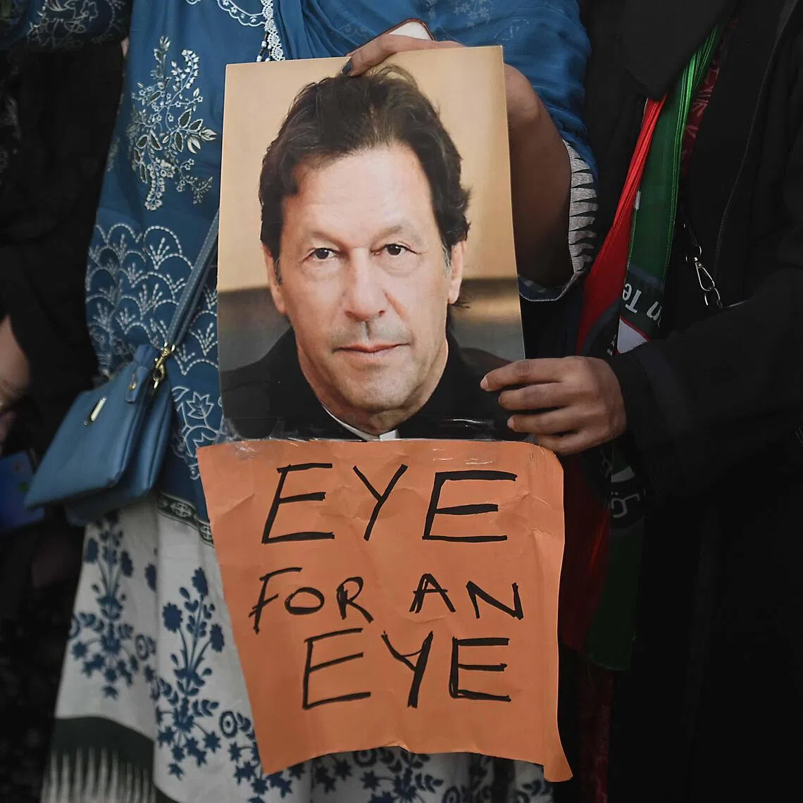 Supporters of jailed former prime minister Imran Khan demand proper medical treatment for him in Karachi, Pakistan, on Feb 13.
