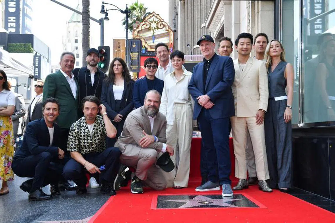 Hollywood producer and Marvel Studios' president Kevin Feige (fifth from right, in black cap) received a star on the Hollywood Walk Of Fame with Marvel Cinematic Universe stars like Chris Evan (top row, second from left), Hugh Jackman (centre, background in white) and Ryan Reynolds (fourth from right) in attendance.