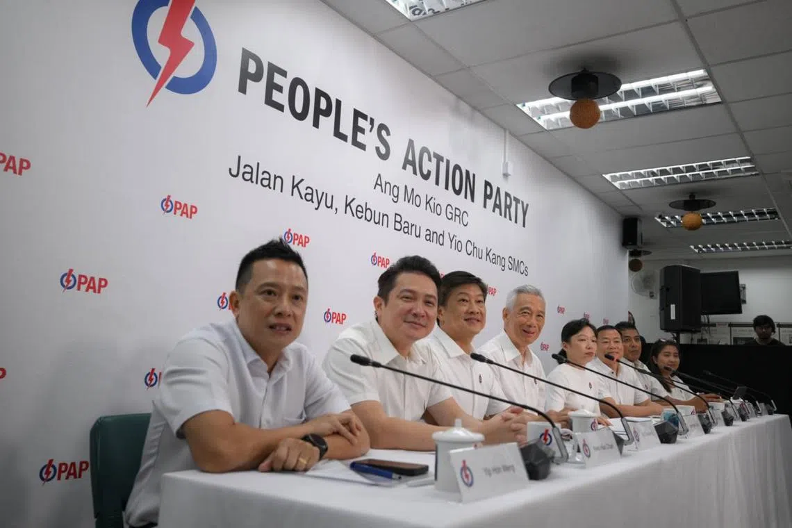 (From left) Mr Yip Hon Weng, Mr Henry Kwek, Mr Ng Chee Meng, SM Lee Hsien Loong, newcomers Ms Jasmin Lau and Mr Victor Lye, Mr Daryl David and Ms Nadia Ahmad Samdin on April 19.