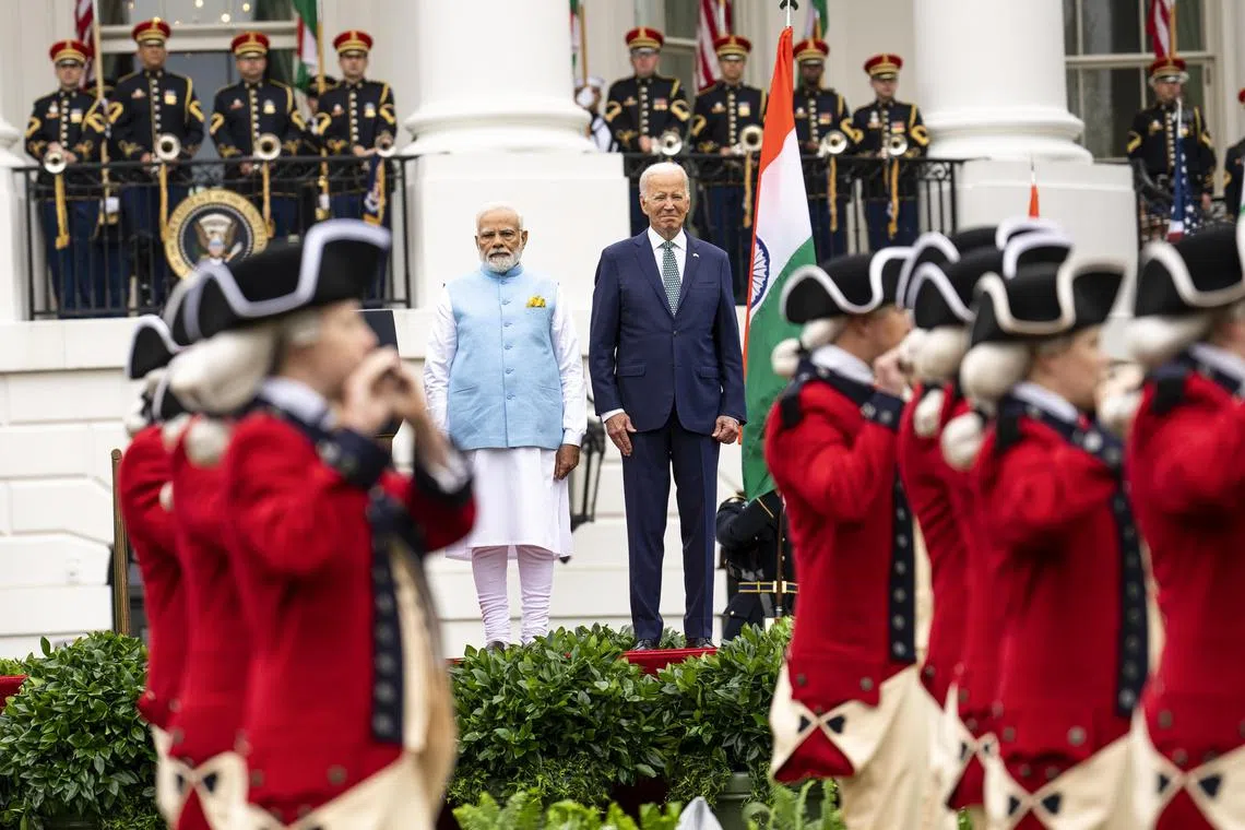 A State Arrival Ceremony is held at the White House to welcome Mr Modi, seen here (centre left) with Mr Biden.