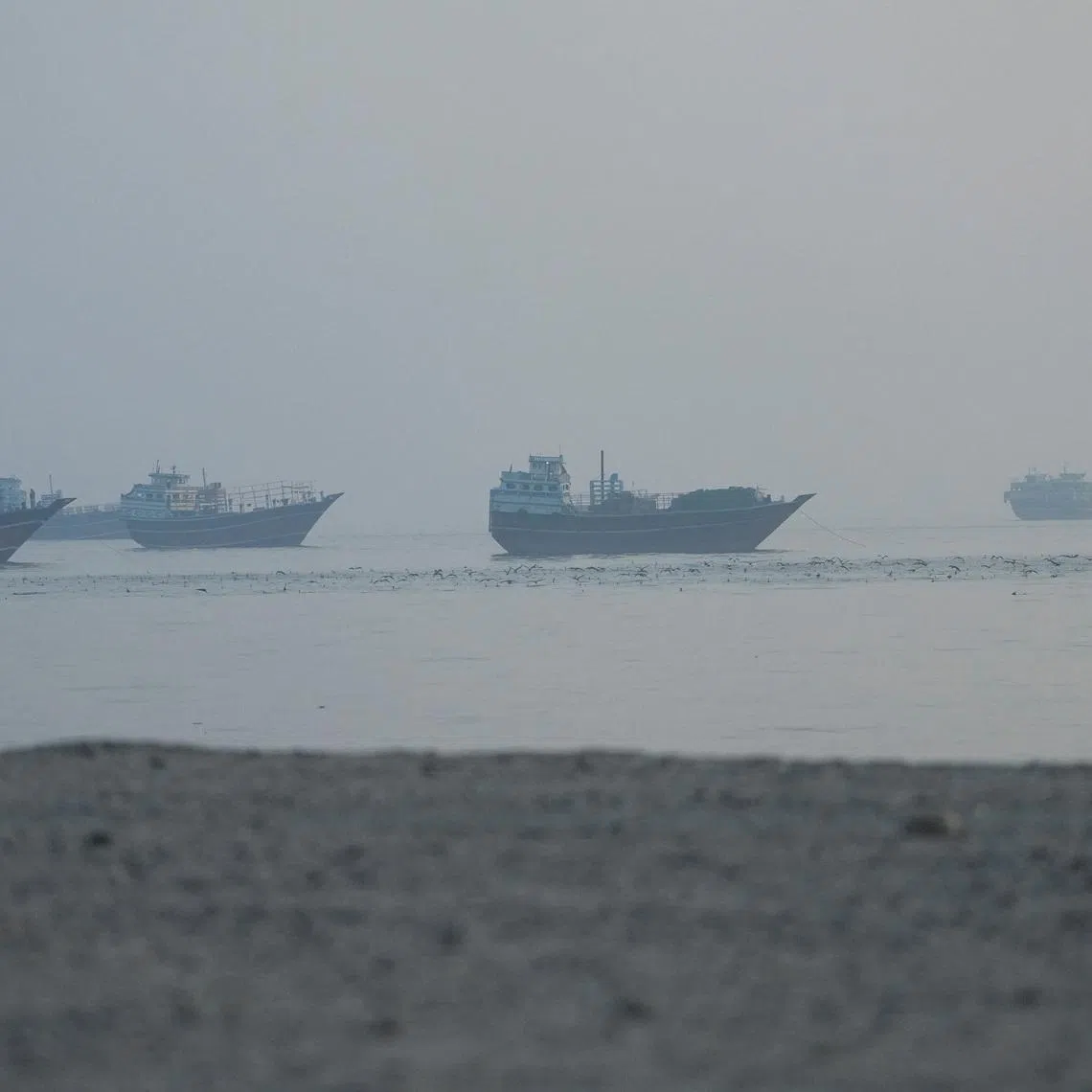 Vessels in the Strait of Hormuz, as seen from Musandam, Oman, June 15, 2026. REUTERS/Stringer