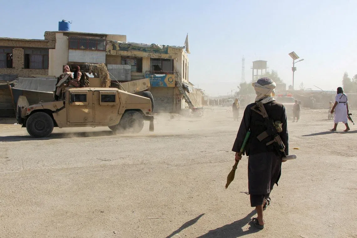 FILE PHOTO: Afghan Taliban fighters patrol near the Afghanistan-Pakistan border in Spin Boldak, Kandahar Province, following exchanges of fire between Pakistani and Afghan forces in Afghanistan, October 15, 2025. REUTERS/Stringer/File Photo