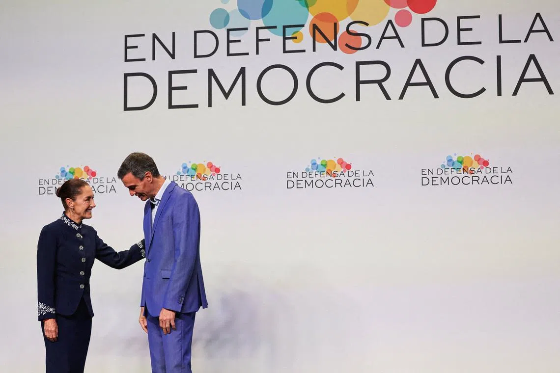 Spain's Prime Minister Pedro Sanchez welcomes Mexico's President Claudia Sheinbaum as leaders arrive at the summit \"In defence of democracy\" in Barcelona, Spain, April 18, 2026. REUTERS/Nacho Doce