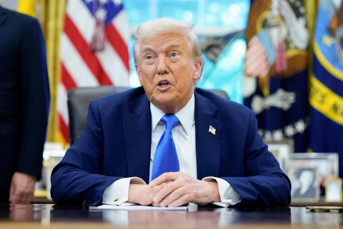 US President Donald Trump speaking to members of the media in the Oval Office on Sept 19, when he signed a proclamation that would move to extensively overhaul the H-1B visa programme.