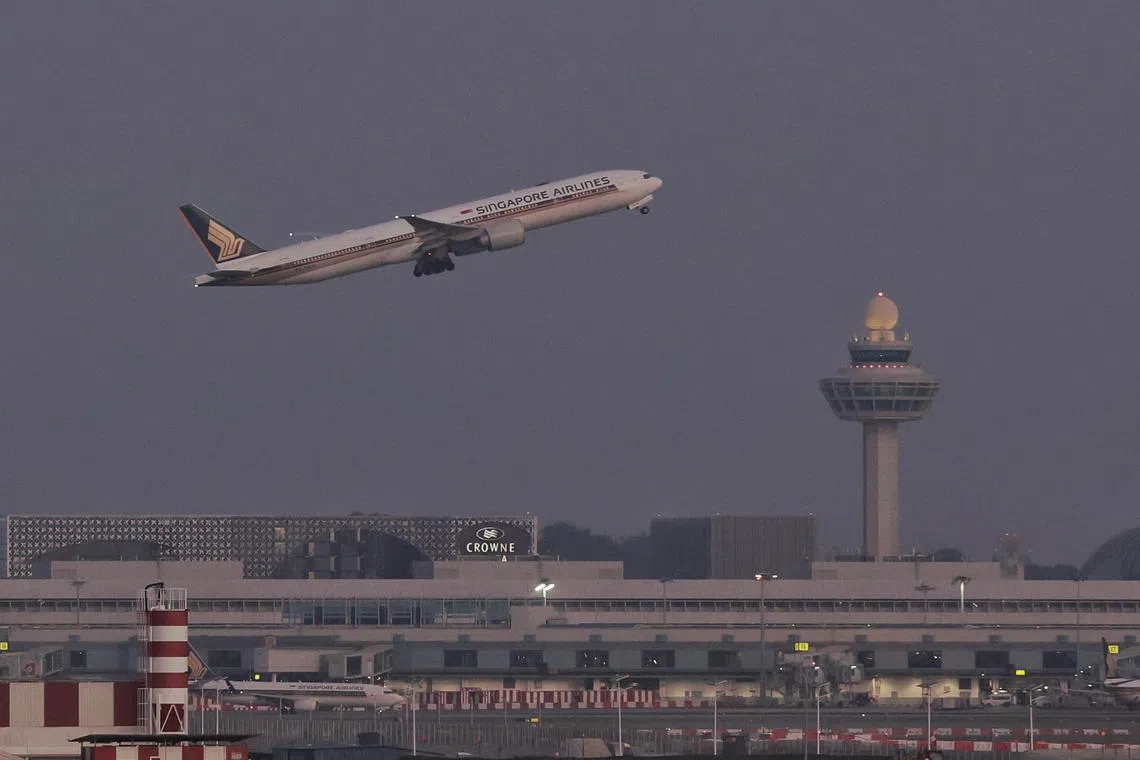 Generic picture of a Singapore Airlines aircraft taking off against the backdrop of the Changi Airport control tower on March 15, 2024. Can be used for stories on travel, SIA, SQ, airfare, fuel, holidays, plane tickets, passengers, Changi Airport, immigrations, departure, economy, air travel, sustainability.