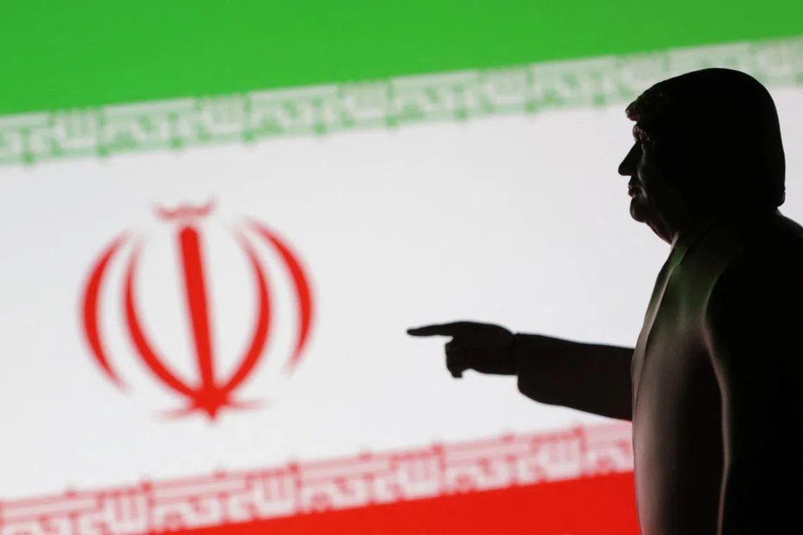 FILE PHOTO: A 3D-printed miniature model depicting U.S. President Donald Trump and Iran flag in this illustration taken,  April 17, 2025. REUTERS/Dado Ruvic/Illustration/File Photo