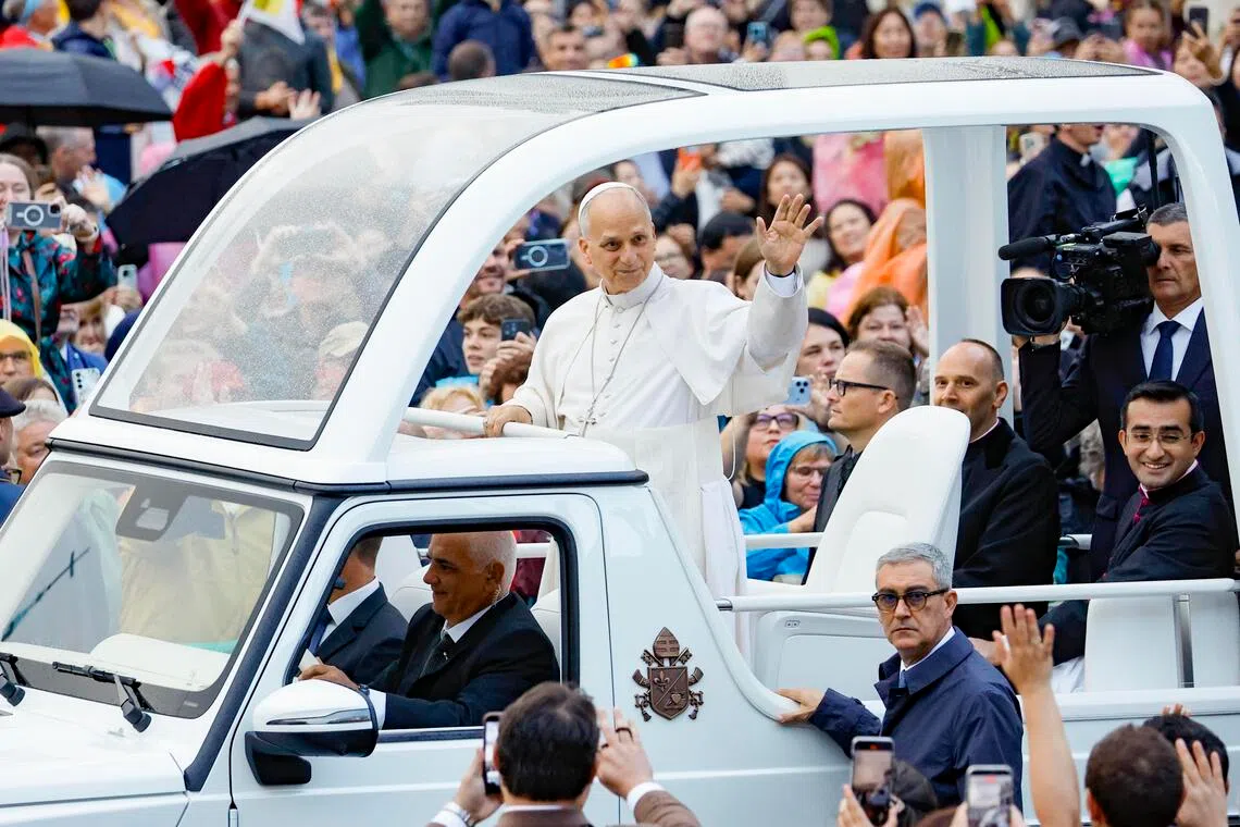 Pope Leo greets the faithful during his weekly general audience in Vatican City on Oct 21.