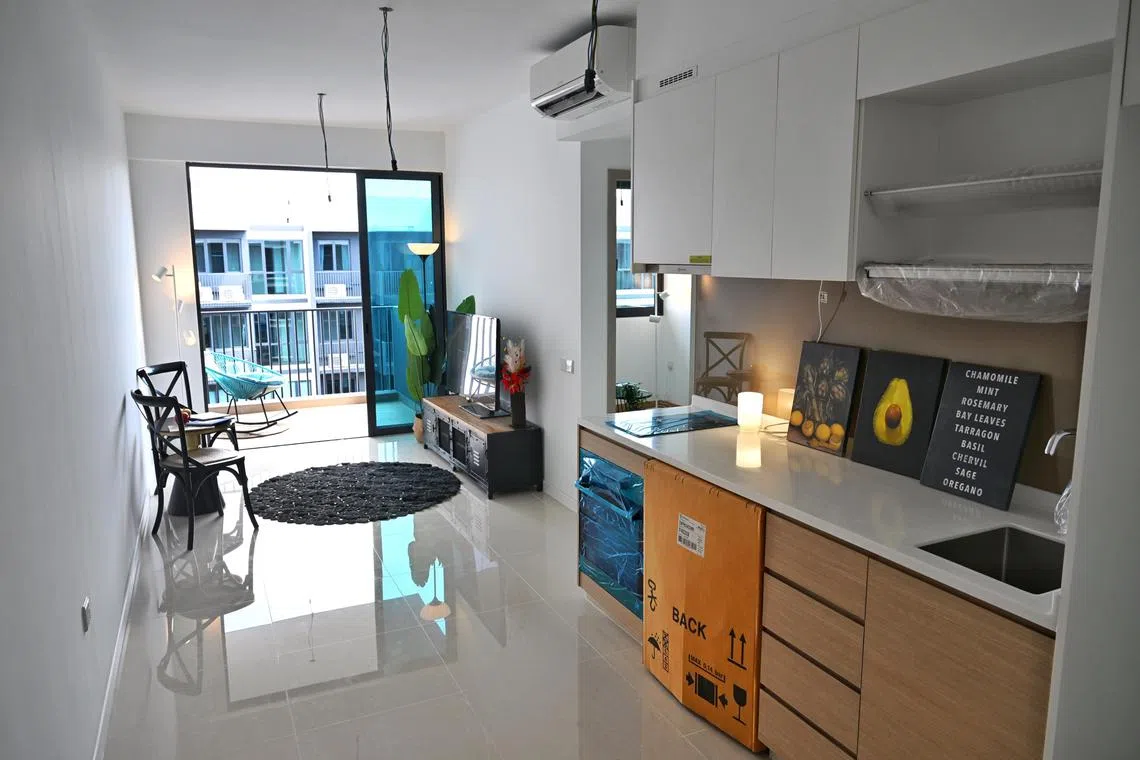 ST20240229_202477300045 jlrental Chong Jun Liang
The kitchen and living room of a 2 bedder unit at Treasure at Tampines condominium photographed on February 29, 2024.