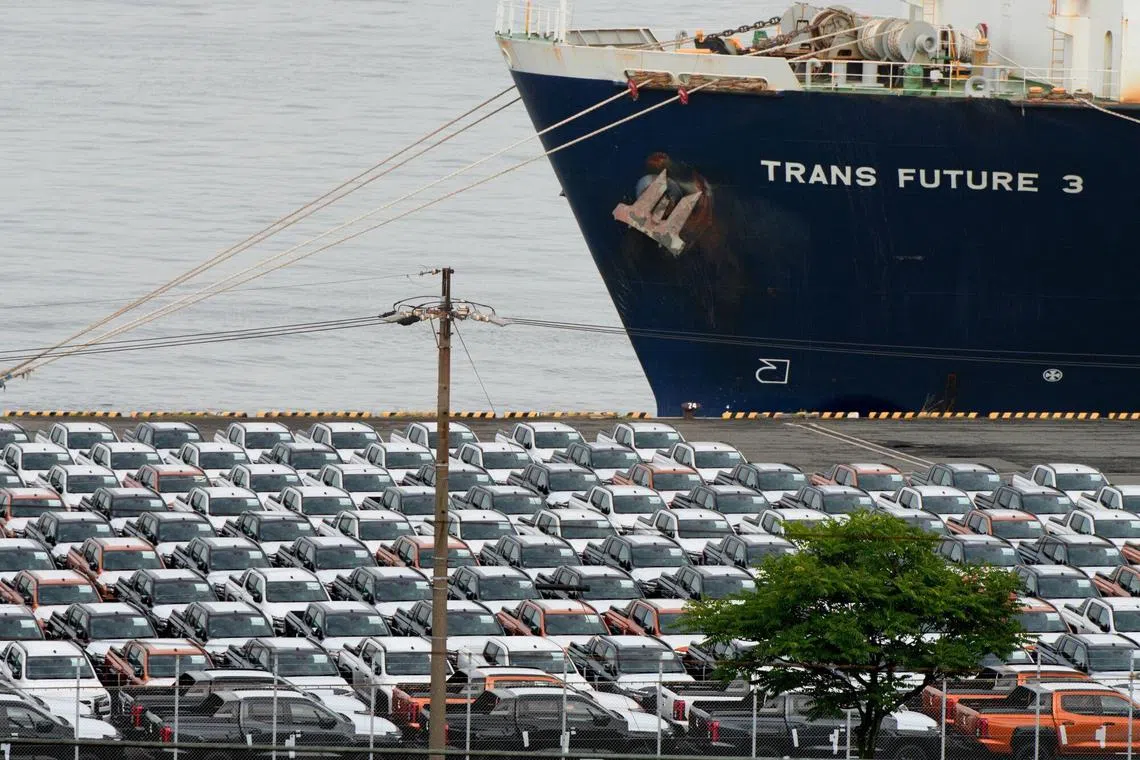 Vehicles bound for shipment parked in front of the Trans Future 3 vehicles carrier ship at the Nagoya Port in Nagoya, Japan, on Tuesday, June 18, 2024. Japan’s exports grew at the fastest clip since late 2022 as the weak yen boosted their value, a positive development for the nation’s manufacturing sector. Photographer: Fred Mery/Bloomberg