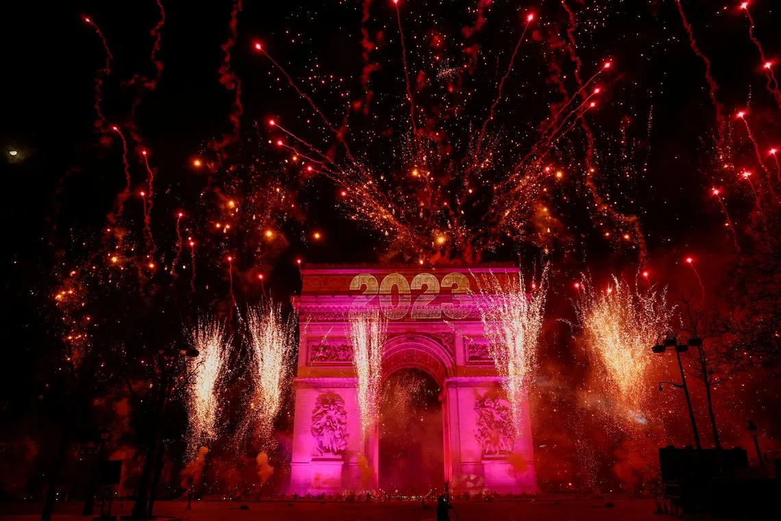 Tsky over the Arc de Triomphe during the New Year's celebrations on the Champs Elysees avenue in Paris, France, Jan 1, 2023. 
