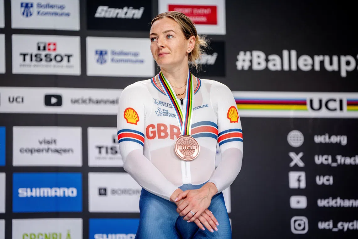 Cycling - UCI Track Cycling World Championships - Ballerup Super Arena, Ballerup, Denmark - October 19, 2024 Bronze medallists Britain's Katy Marchant celebrates on the podium after the women's 500m time trial final  Mads Claus Rasmussen/Ritzau Scanpix via REUTERS