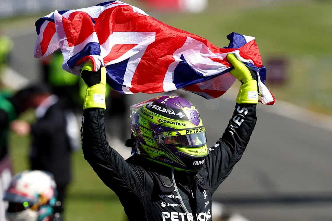 Mercedes' Lewis Hamilton celebrating after winning the British Grand Prix at Silverstone on July 7.